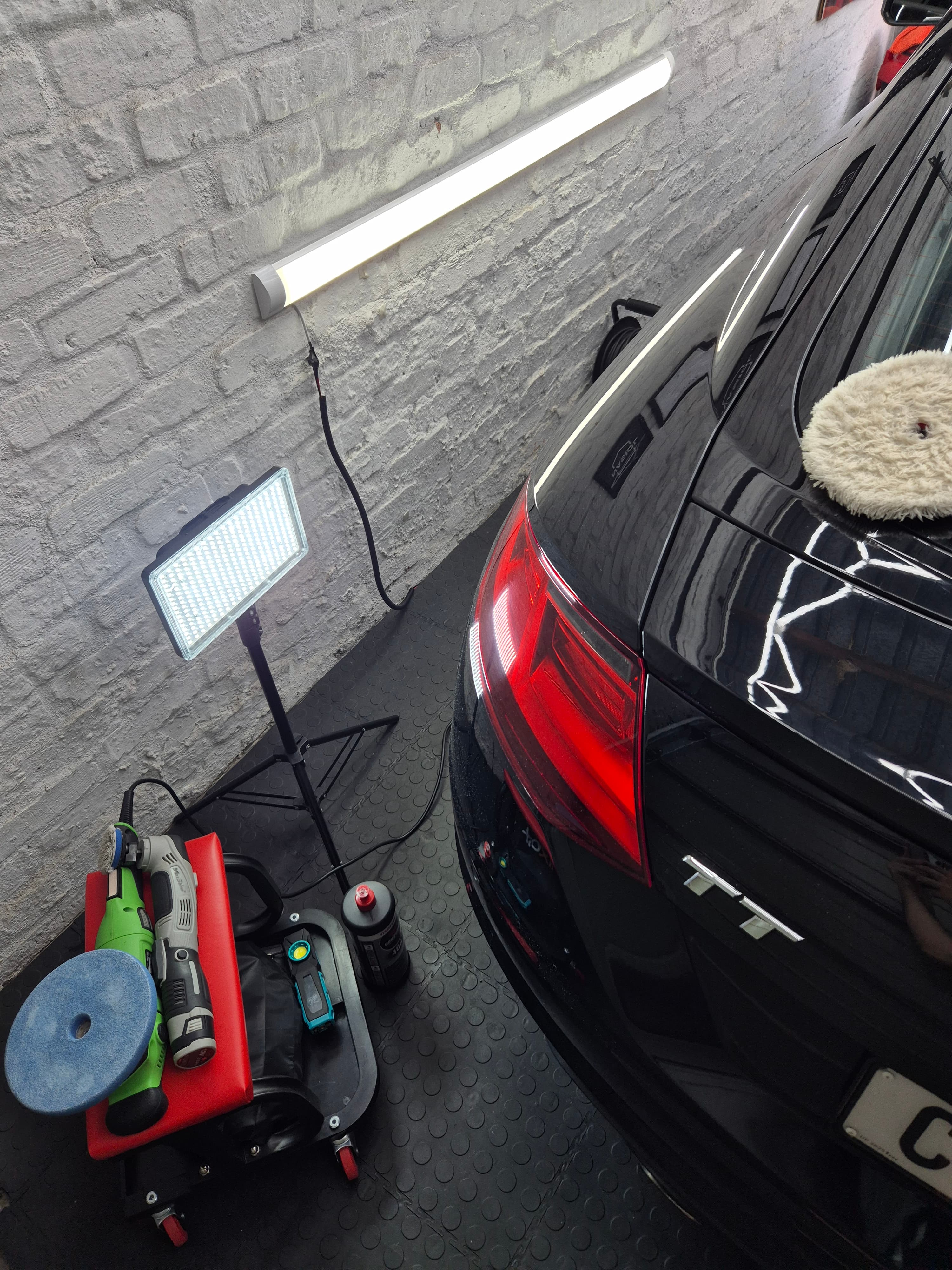 Paint correction in progress — dual-action polisher on Audi TT